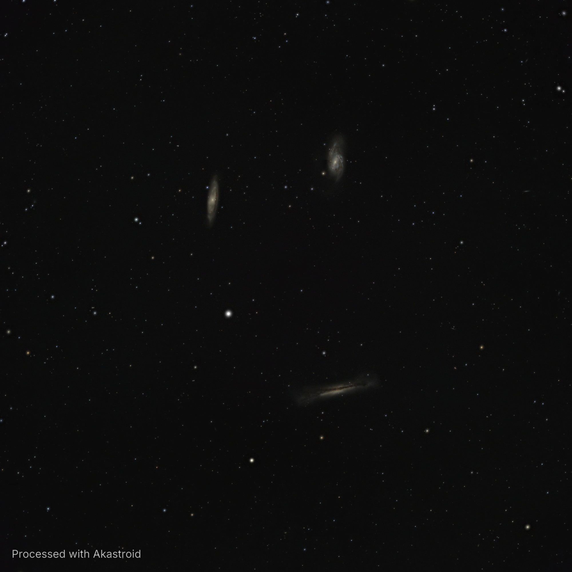 The Leo Triplet galaxies M65, M66 and the edge-on NGC 3628 with its dust lane, processed in Akastroid