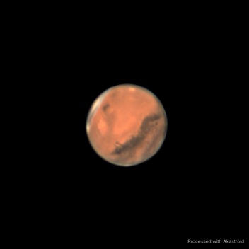 Mars showing dark surface markings, stacked and sharpened in Akastroid