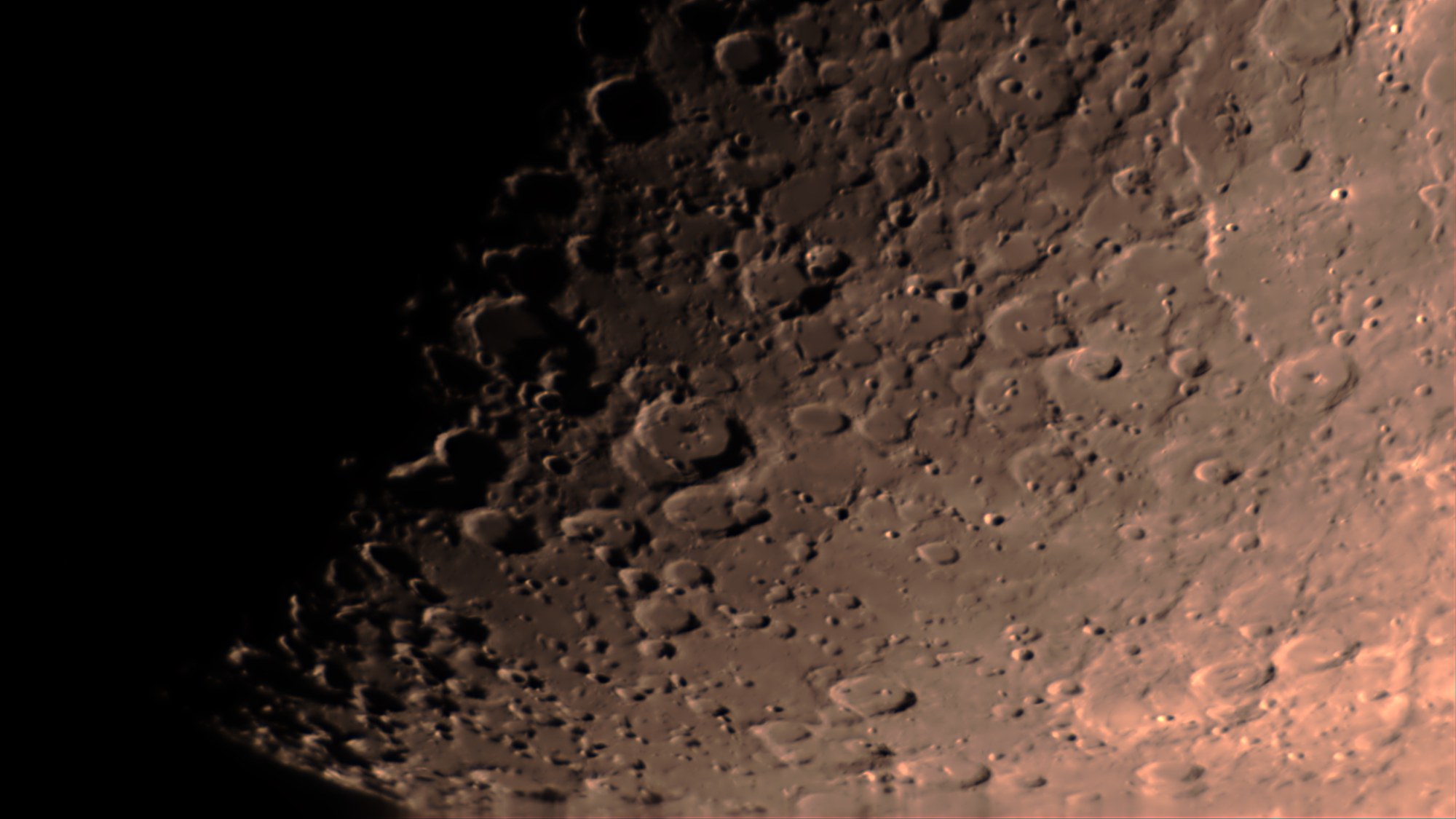 Close-up of the Moon's cratered southern highlands at the terminator, processed in Akastroid